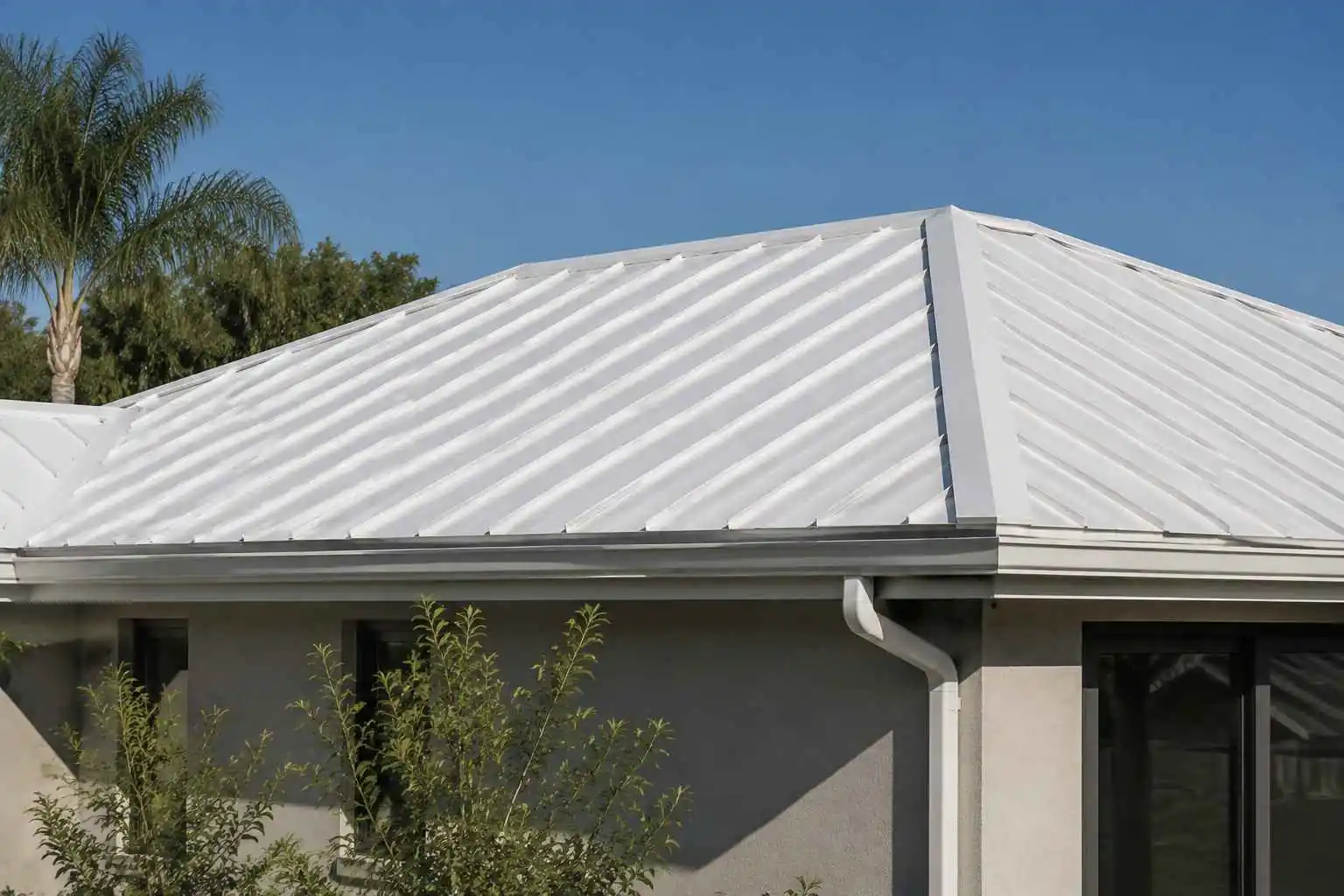 White reflective metal roof on a modern home