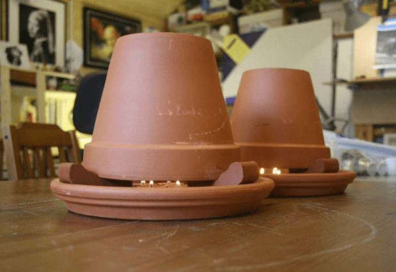 Two Clay Pot Heaters in Action